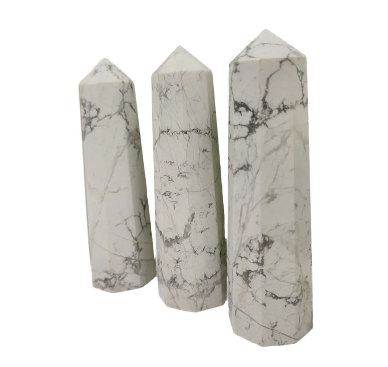 white howlite tower, white with delicate grey veining patterns, highlighting its natural beauty.