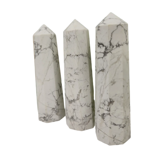 white howlite tower, white with delicate grey veining patterns, highlighting its natural beauty.